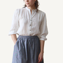 Load image into Gallery viewer, Person wearing a white blouse with puffed sleeves and a gray skirt on a plain background