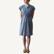 Load image into Gallery viewer, Woman wearing a blue floral dress on a white background