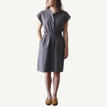 Load image into Gallery viewer, Woman wearing a gray dress on a white background