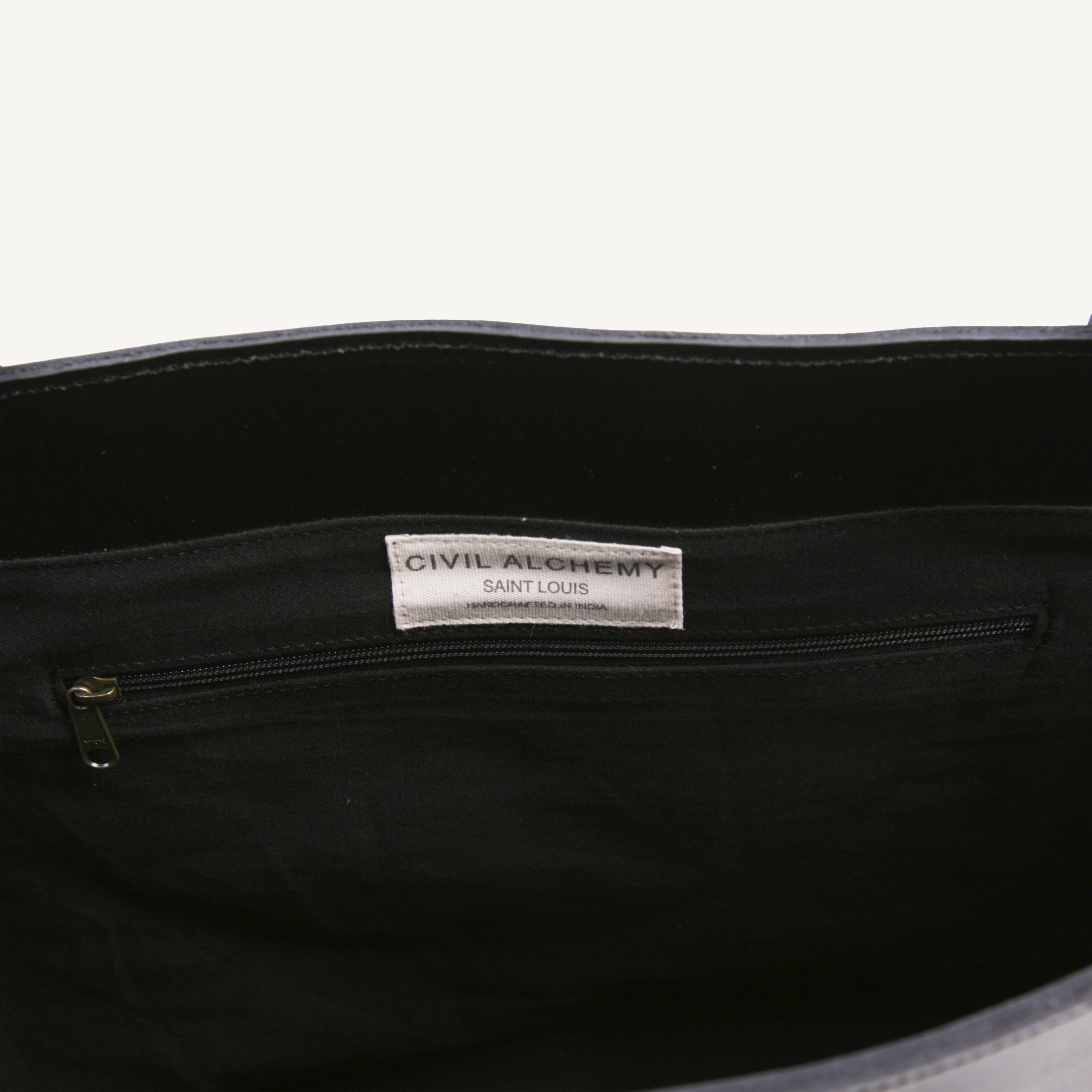 Black bag with a visible brand label on a white background