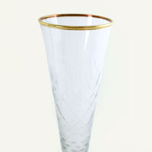 Load image into Gallery viewer, Clear glass flute with gold rim on a white background
