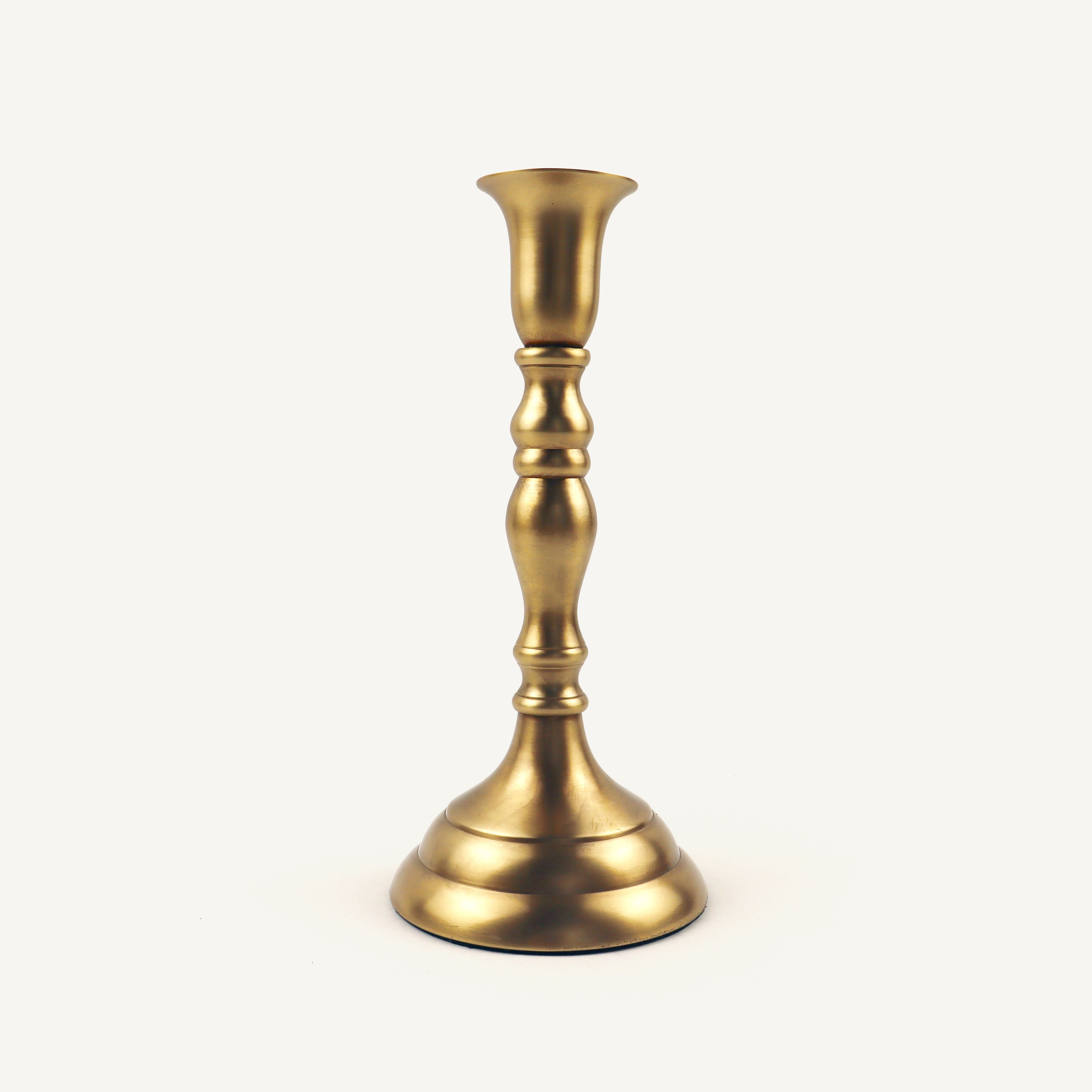 Gold candle holder on a white background