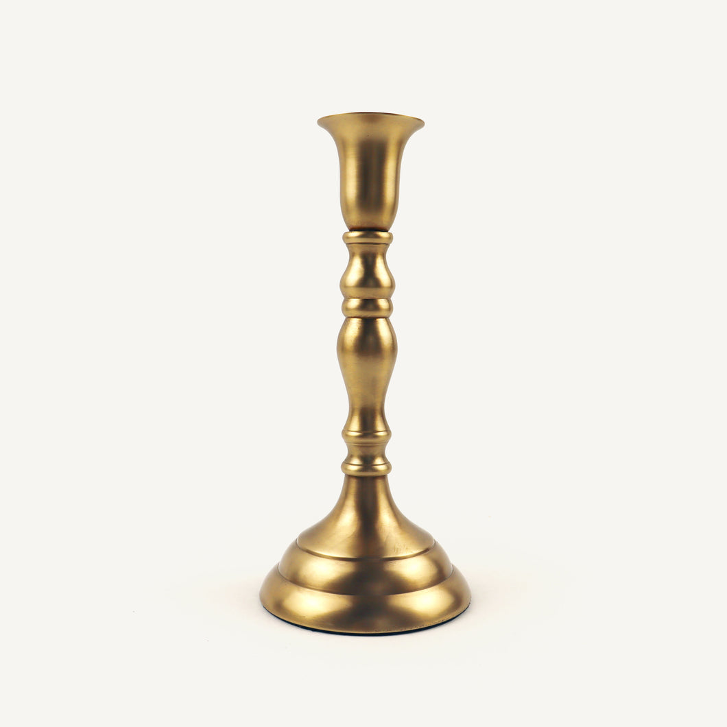Gold candle holder on a white background