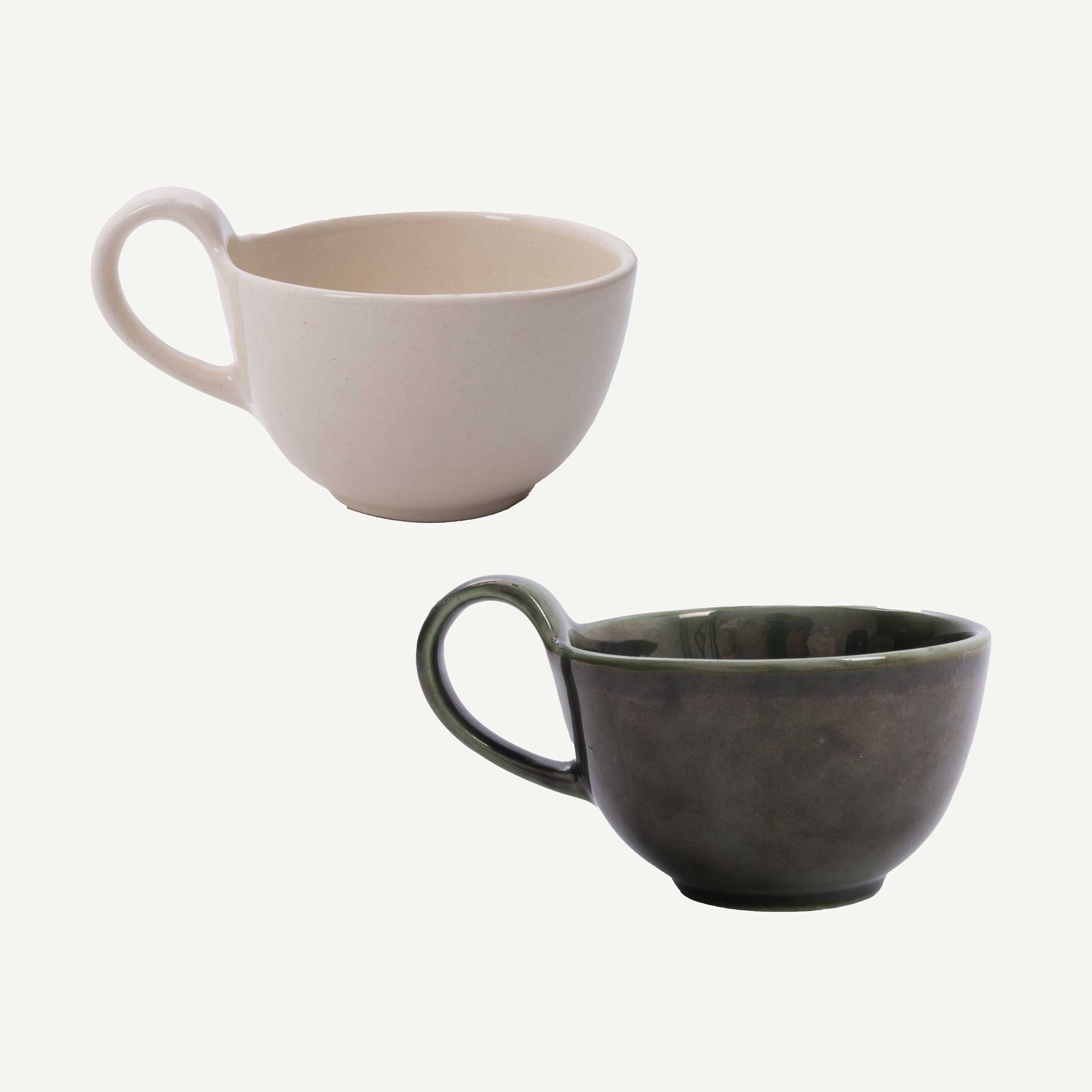 Two ceramic mugs, one beige and one gray, on a white background