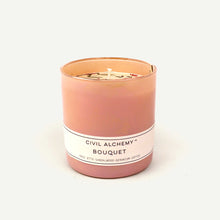 Load image into Gallery viewer, Pink candle with a white label on a light beige background
