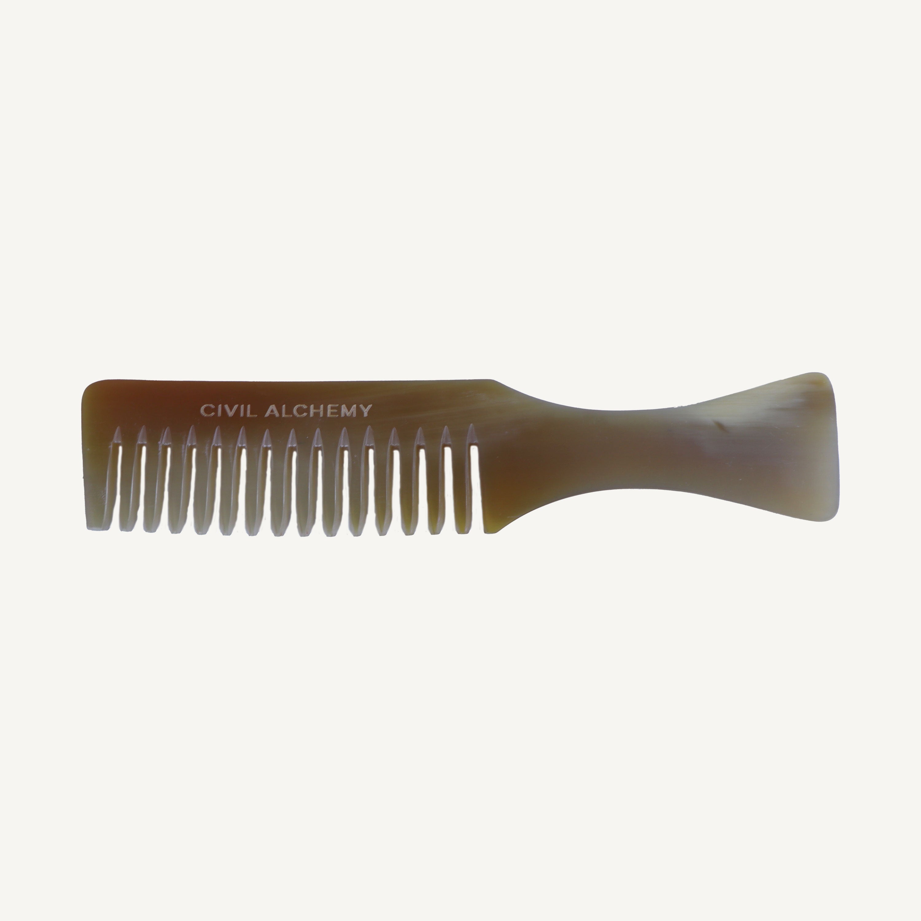 Comb with 'Civil Alchemy' branding on a white background