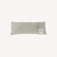 Load image into Gallery viewer, Green eye pillow with a brand label on a white background
