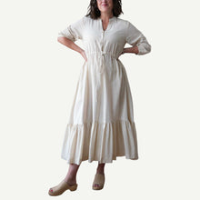 Load image into Gallery viewer, Woman wearing a white dress on a plain background
