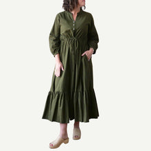 Load image into Gallery viewer, Woman wearing a green dress on a white background
