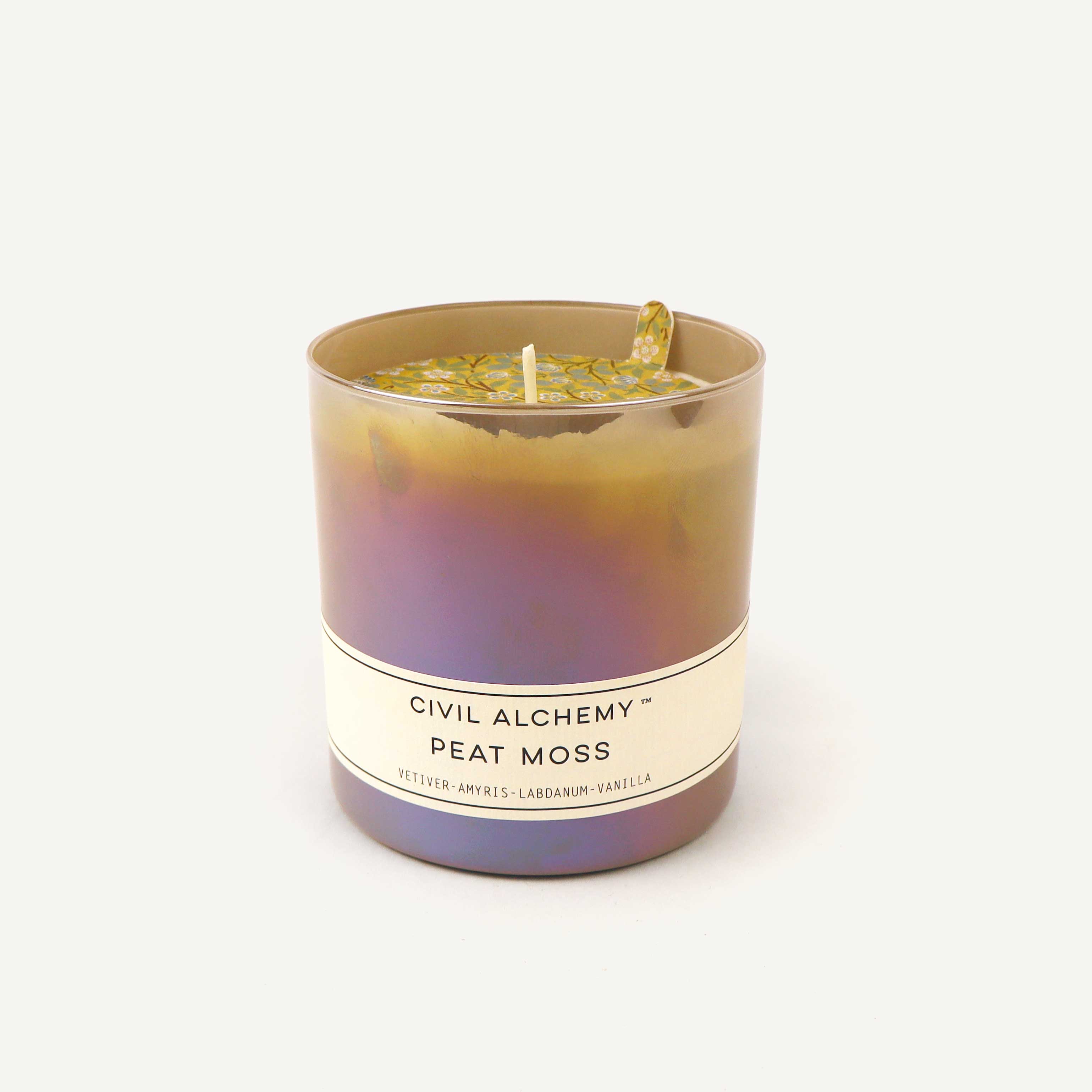 Candle with a label reading 'Civil Alchemy Peat Moss' on a white background