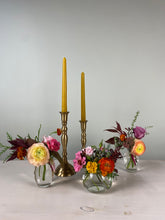 Load image into Gallery viewer, Decorative floral arrangement with a gold candlestick holder on a white background
