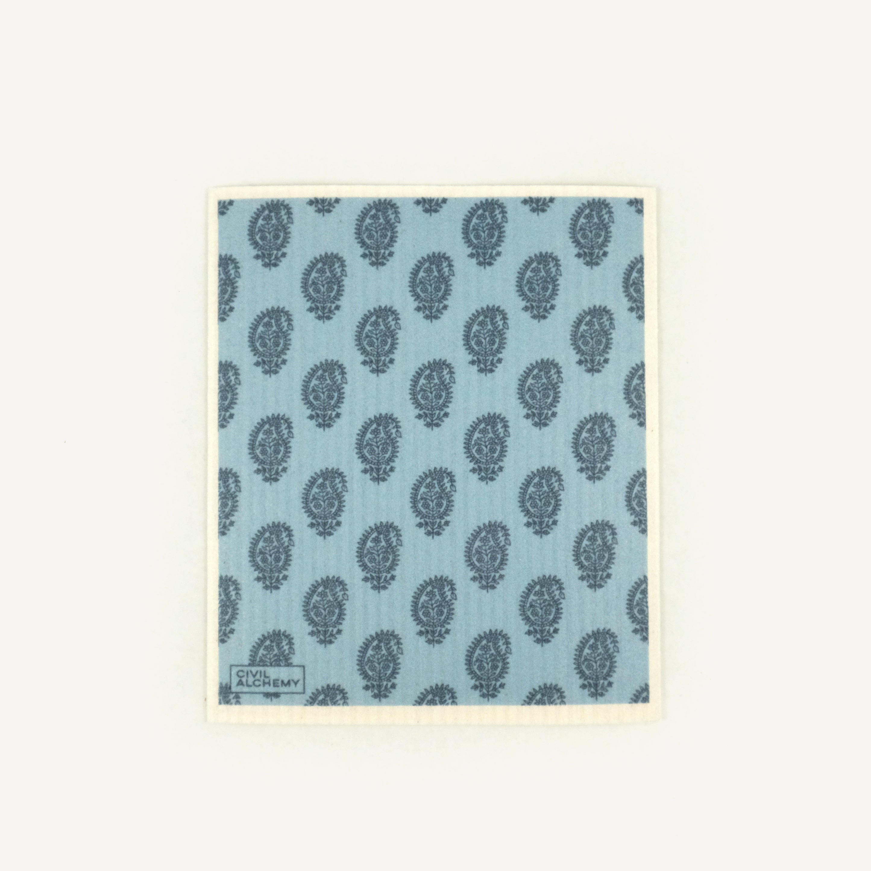 Patterned Swedish dishcloth with blue and green design on a light blue background