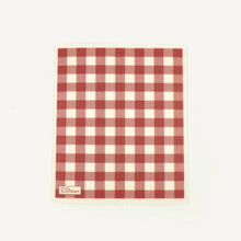 Load image into Gallery viewer, Red and white checkered towel with 'Civil Alchemy' branding on a light beige background
