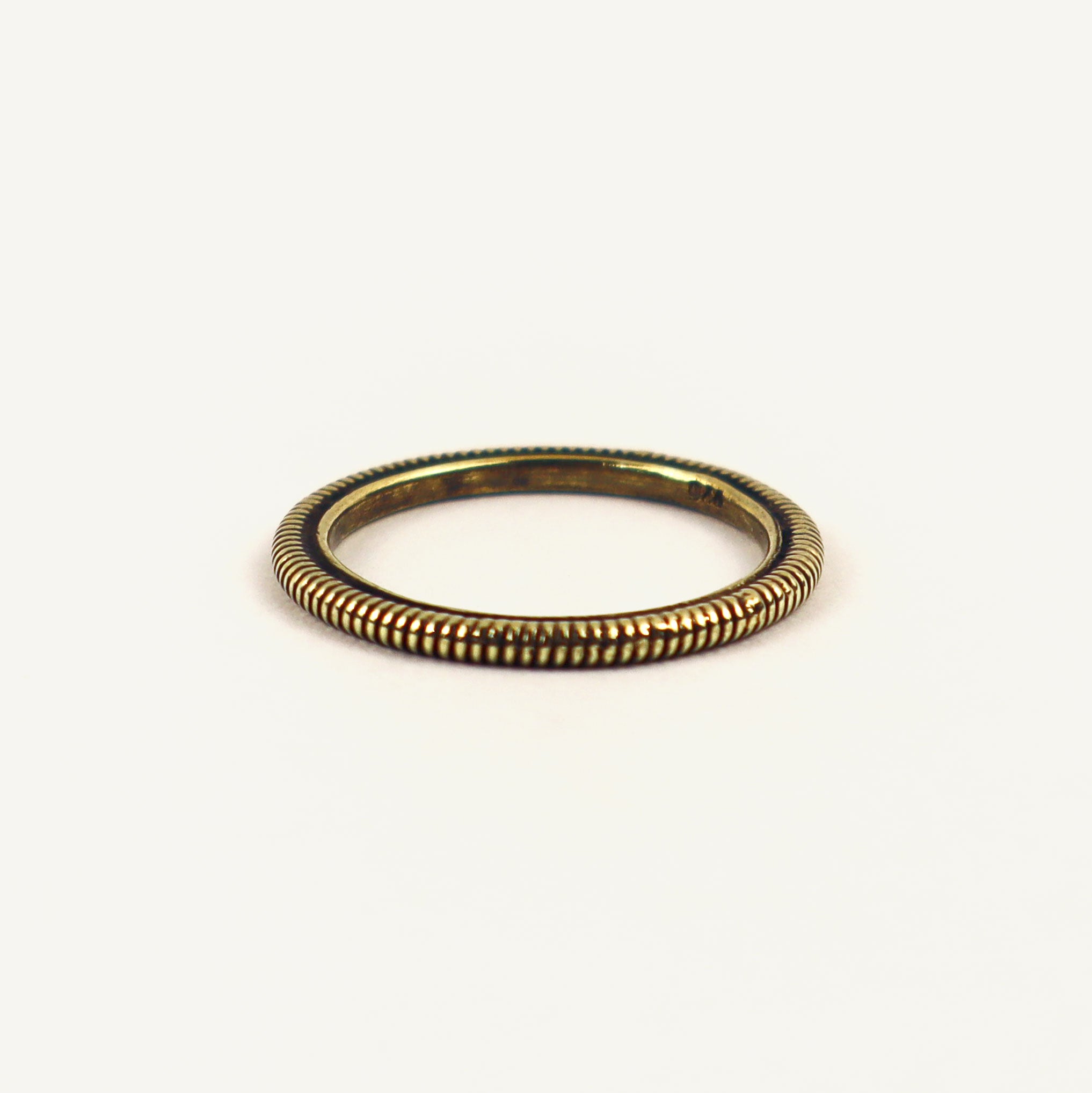 Gold ring on a white background