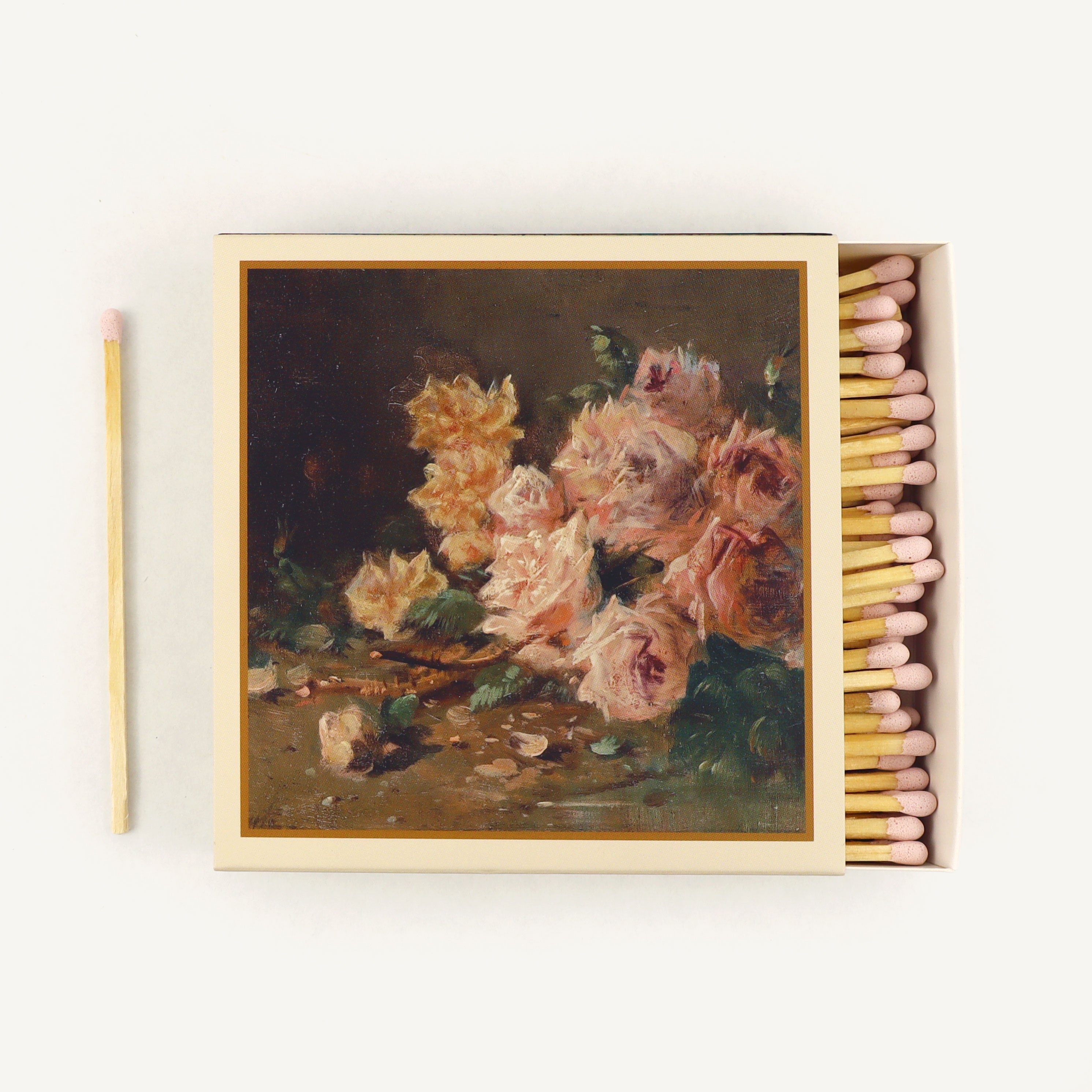 Matchbox with floral painting on a white background