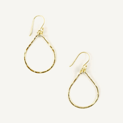 Gold teardrop earrings on a white background